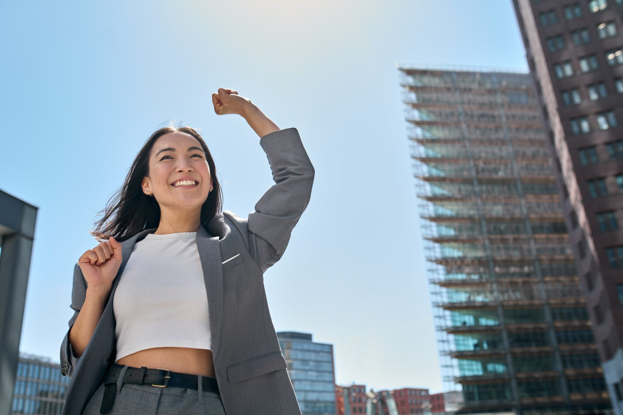 Close up of a women celebrating with her fist in the air