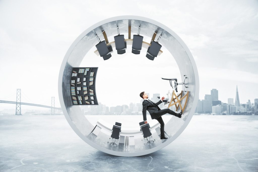 unning businessman inside concrete cylinder on