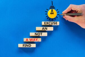 wooden blocks spelling out "find a way, not an excuse"