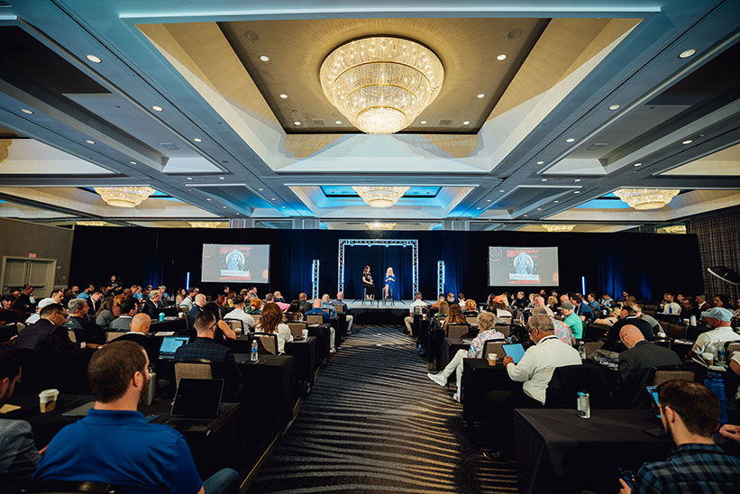 Sharon Lechter speaking on a panel in front of an audience
