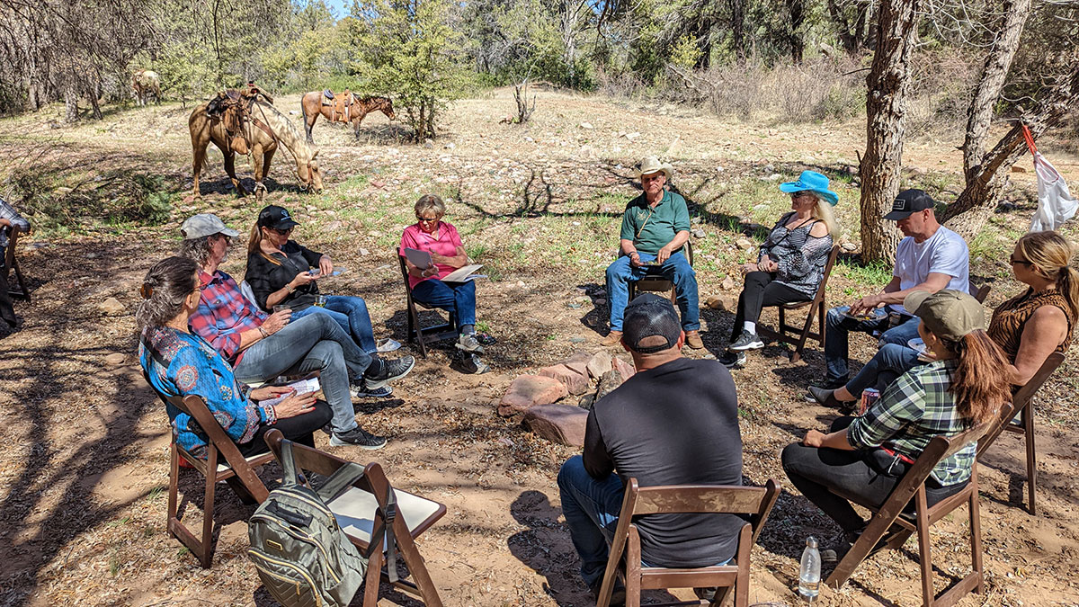 Sharon Lechter with a group of people on her mentor weekend at Cherry Creek Lodge