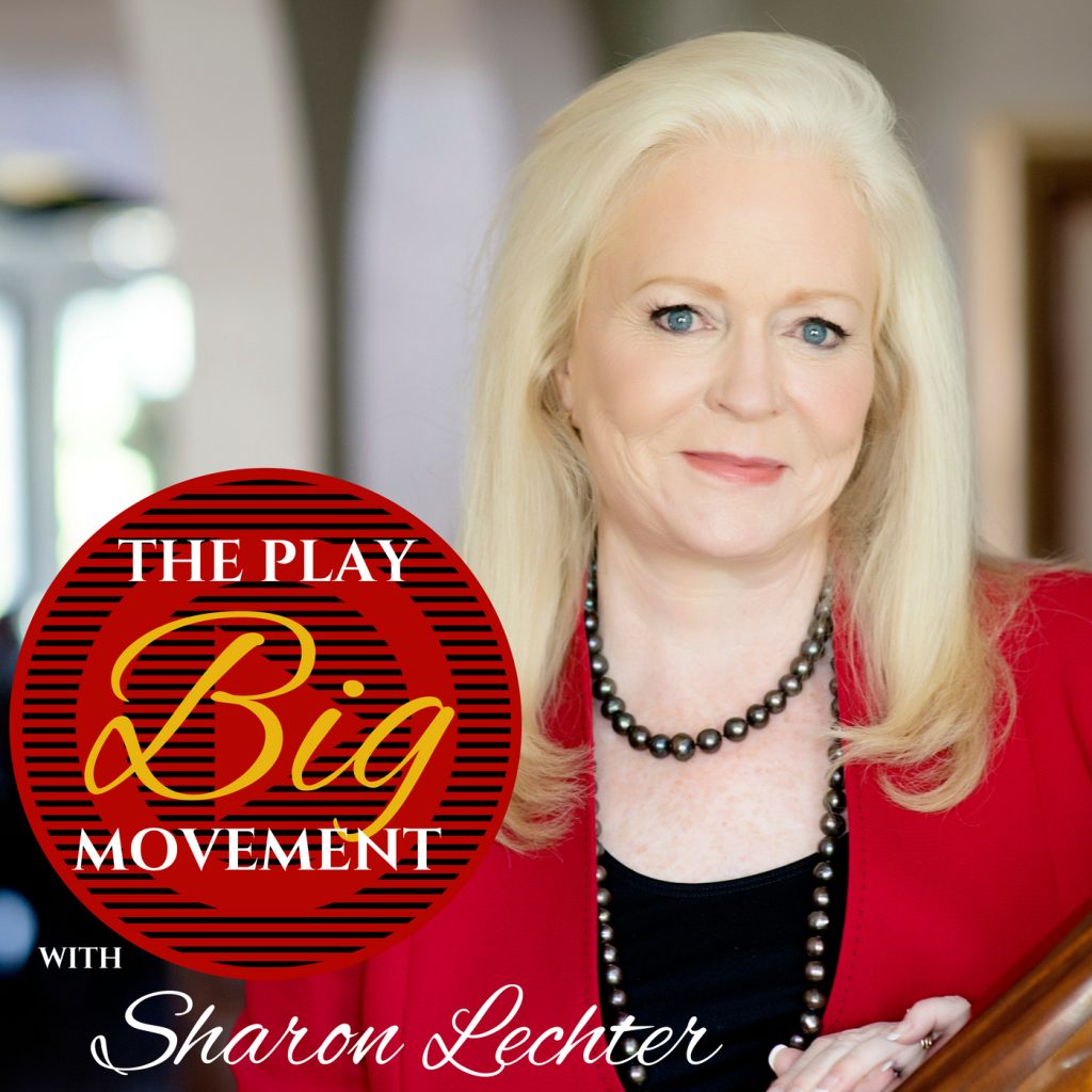 A woman with long blond hair, wearing a red blazer and black beaded necklace, stands indoors. Overlay text reads: The Play Big Movement with Sharon Lechter in a red and yellow circular graphic.
