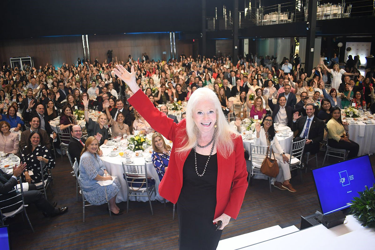 Sharon Lechter on stage at a corporate event