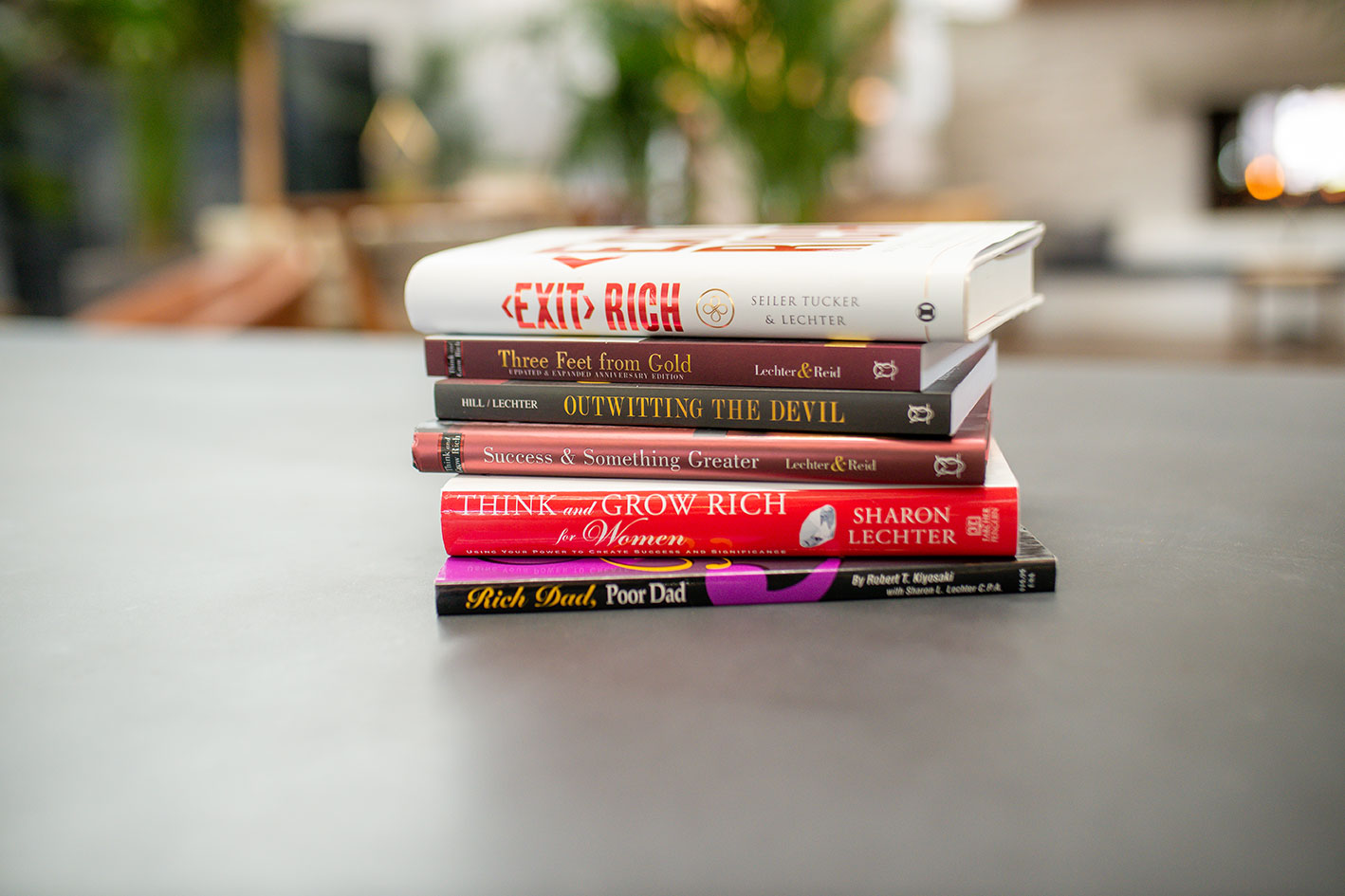 Showcase of Sharon Lechter's books stacked