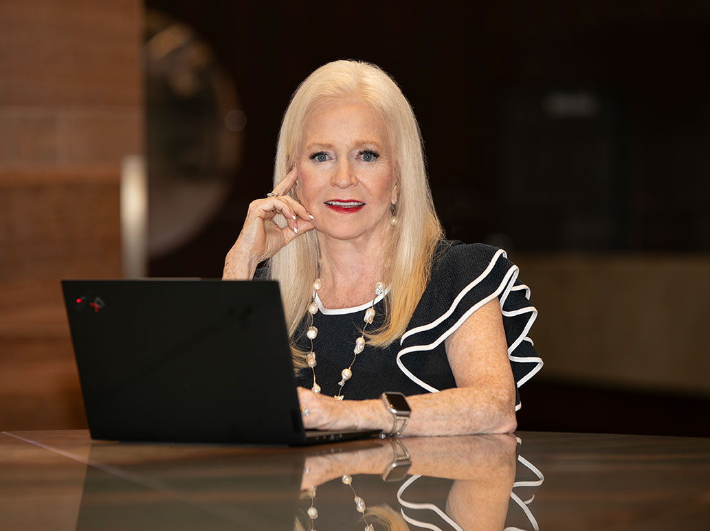 Sharon Lechter working on a thinkpad laptop computer