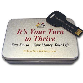 A silver metal box labeled "It's Your Time to Thrive - Digital Download" holds a black USB flash drive resting on top. The USB is marked ItsYourTurnToThrive.com.