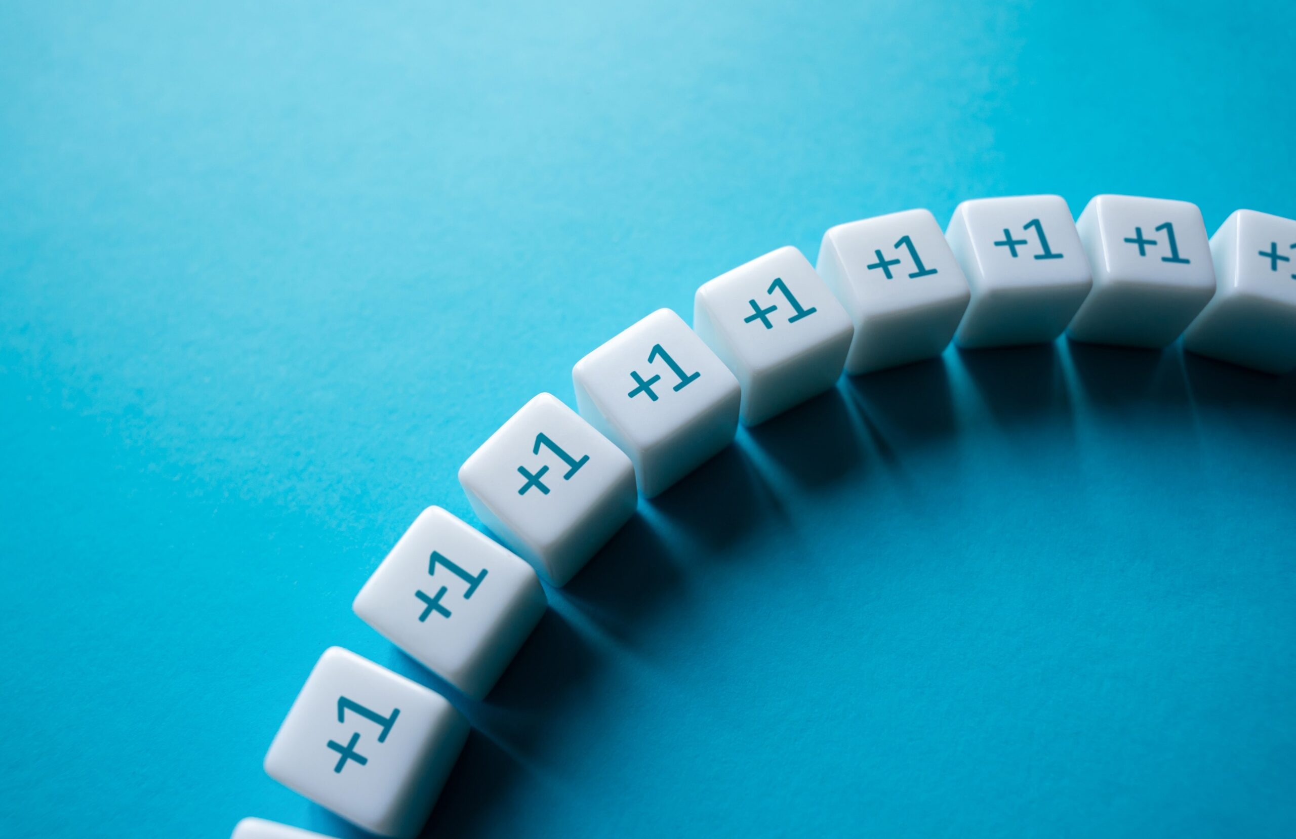 White cubes display "+1" in a curved line on a cyan background