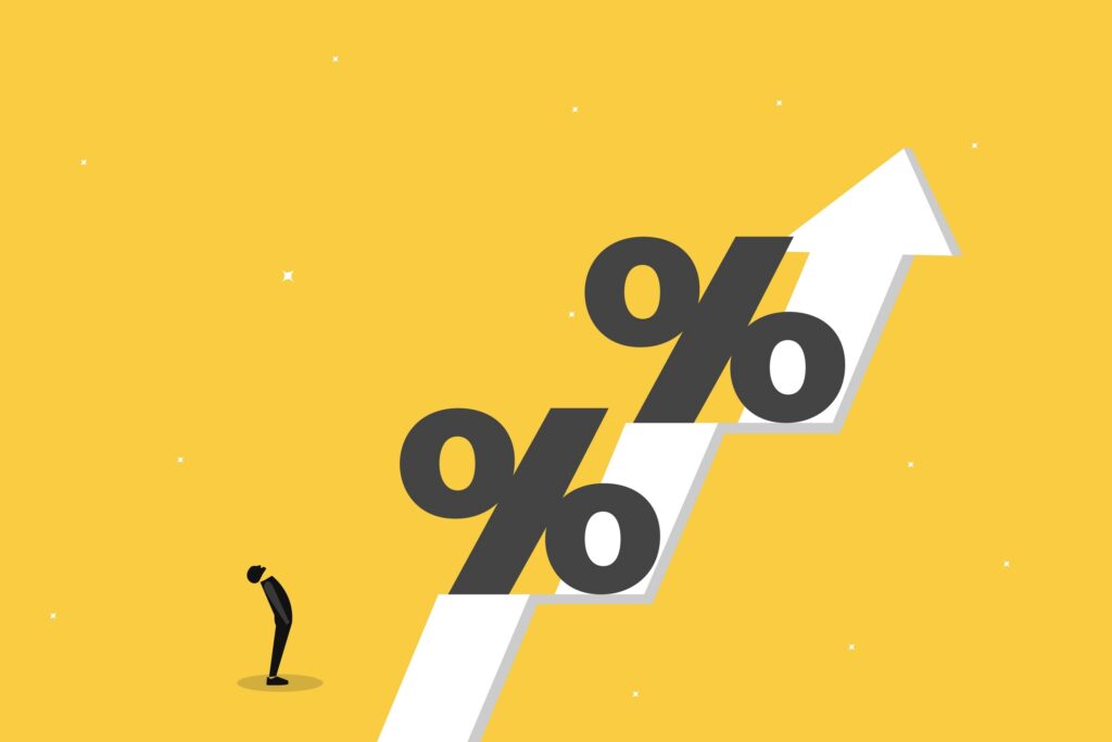 Illustration of a person standing below a rising white arrow with large percent signs on it